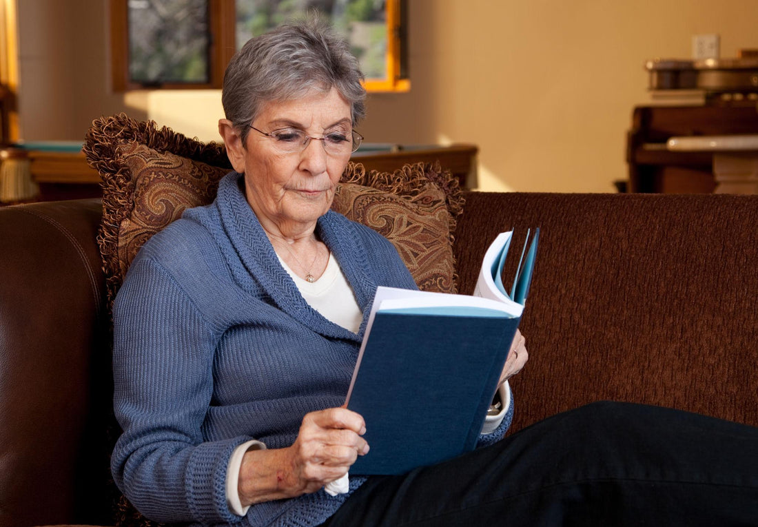 Senior reading at home in a calm environment, illustrating mental activity and brain engagement